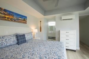 a bedroom with a bed and a white dresser at Wailea Hidden Gem in Wailea +48 photos