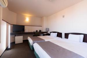 Postel nebo postele na pokoji v ubytování Hotel Honjo