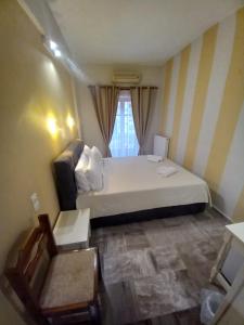 Кровать или кровати в номере Hermes Hotel
