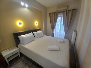 Кровать или кровати в номере Hermes Hotel