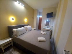 Кровать или кровати в номере Hermes Hotel