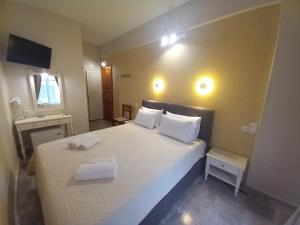 Кровать или кровати в номере Hermes Hotel