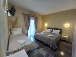Кровать или кровати в номере Hermes Hotel