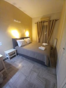 Кровать или кровати в номере Hermes Hotel