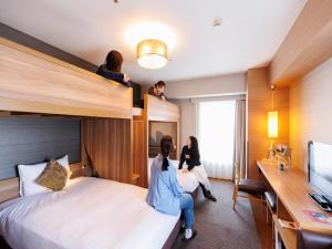 Cama ou camas em um quarto em Hotel Resol Trinity Hakata