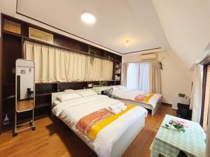 Letto o letti in una camera di Jl千住別荘