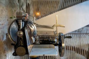 an old fashioned airplane hanging on a wall at Hotel Boutique Patio del Posadero in Córdoba