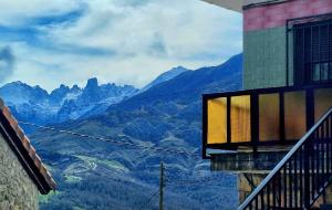 a window of a building with a view of mountains at VV Casa Leonor in Asiego