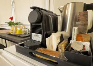 a kitchen counter with a container of food at Vatican Dolce Remy Guest House - Metro Cipro in Rome +18 photos