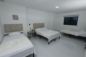Letto o letti in una camera di Hotel Astor Cucuta