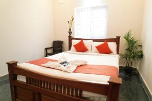 Postel nebo postele na pokoji v ubytování UNIQUE RESORT Inn Yercaud