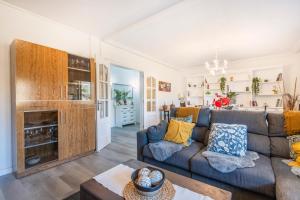 a living room with a couch and a table at Casa pablo y francisca in Alfarrás