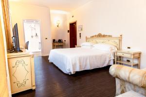Postel nebo postele na pokoji v ubytování Hotel Stendhal