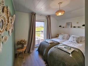Postel nebo postele na pokoji v ubytování À la lisière du bois