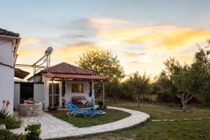 a house with a pathway leading to a yard at Petalidi Sunny Home One - Charming Garden Nest in Petalidi +29 photos