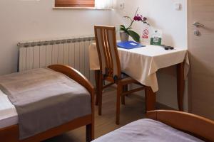 a room with a table and a chair and a table and a table at Studio Apartman Šafranko in Krapinske Toplice +9 photos