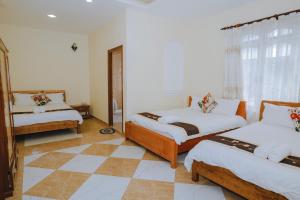 Postel nebo postele na pokoji v ubytování Nam Đông hotel