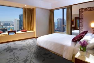 Postel nebo postele na pokoji v ubytování Lan Kwai Fong Hotel - Kau U Fong