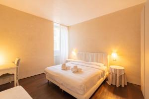 Postel nebo postele na pokoji v ubytování Relais La Torre