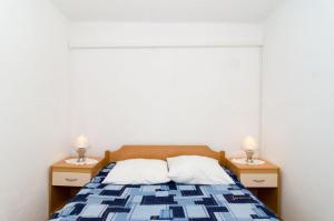 Postel nebo postele na pokoji v ubytování Apartments Žuronja