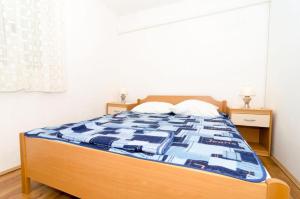 Postel nebo postele na pokoji v ubytování Apartments Žuronja