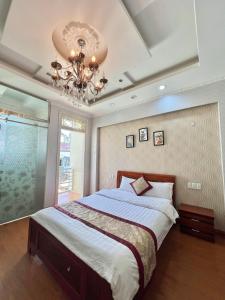 Letto o letti in una camera di Dang Uyen 1 Hotel