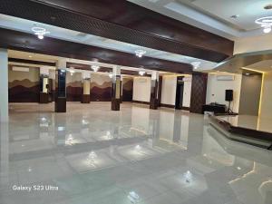 a large lobby with a marble floor in a building at The Lumber Hotel and Resort in Virac