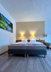 Postel nebo postele na pokoji v ubytování Pension zum Ritter
