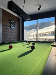 a pool table with balls on it in a room at Camporrosso43 luxury penthouse, jacuzzi, billiards in Finestrat