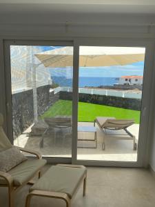 a living room with a view of the ocean at VV Sal y Mar Apartment in Los Cancajos