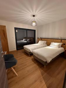 Postel nebo postele na pokoji v ubytování Domaine de Haslach, The Originals Collection, Résidence de Tourisme + 53 fotografií