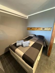 a bedroom with a bed with two pillows on it at Il Ducale a Playa del Inglés in Playa del Ingles +10 photos