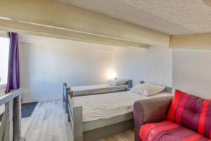 Ένα ή περισσότερα κρεβάτια σε δωμάτιο στο Appartement T2 Cap d'Ag