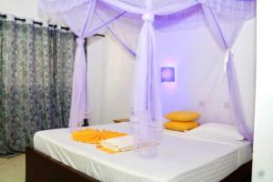 Postel nebo postele na pokoji v ubytování Papillon Garden Bar Villas