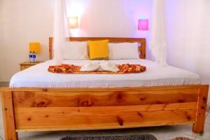 Postel nebo postele na pokoji v ubytování Papillon Garden Bar Villas