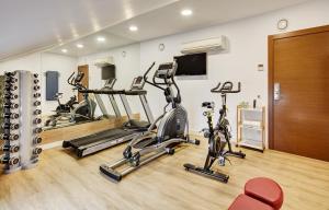 a gym with three exercise bikes in a room at Sercotel Calle Mayor in Logroño +79 photos