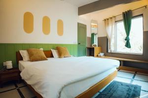 Art Bliss Hostel客房内的一张或多张床位