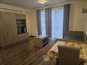 A television and/or entertainment centre at Ádám Guesthouse I.