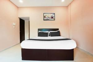 Postel nebo postele na pokoji v ubytování Super Hotel O Hingna Road Near Rachana Metro Station + 23 fotografií