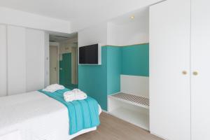 Postel nebo postele na pokoji v ubytování Hotel Tiffany's