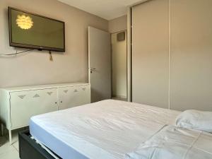 a bedroom with a bed and a flat screen tv at Appartement 3 pièces- 4 personnes- ARGELES VILLAGE AR075-012 in Argelès-sur-Mer