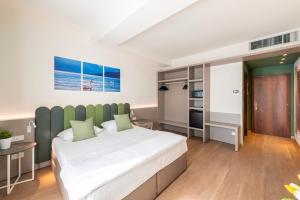 Postel nebo postele na pokoji v ubytování Hotel Pineta Campi