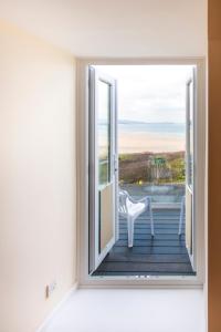 a room with a window with a view of the ocean at The Penellen guest accommodation room only in Hayle