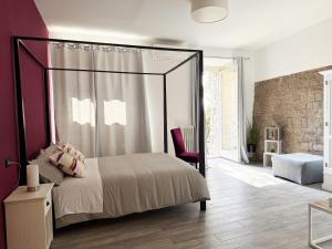 Postel nebo postele na pokoji v ubytování Il Cortile di Assisi