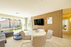 a living room with a table and chairs at LUXURY Sun Club 252 in San Bartolomé de Tirajana