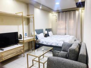 TV a/nebo společenská místnost v ubytování Carousel Hotel