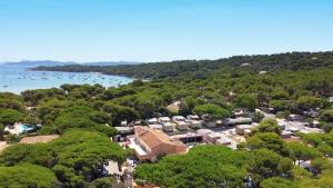 an aerial view of a town with trees and a lake at Camping Tikayan Le Méditerranée - Maeva in Hyères