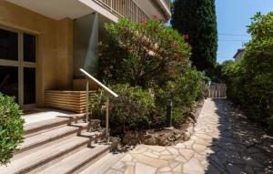 a house with stairs and flowers in front of it at Studio Cannes Californie in Cannes +5 photos