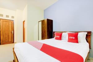 Voodi või voodid majutusasutuse Hotel O Pogung Near Near Ugm Formerly Maleo Residence toas