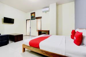Voodi või voodid majutusasutuse Hotel O Pogung Near Near Ugm Formerly Maleo Residence toas
